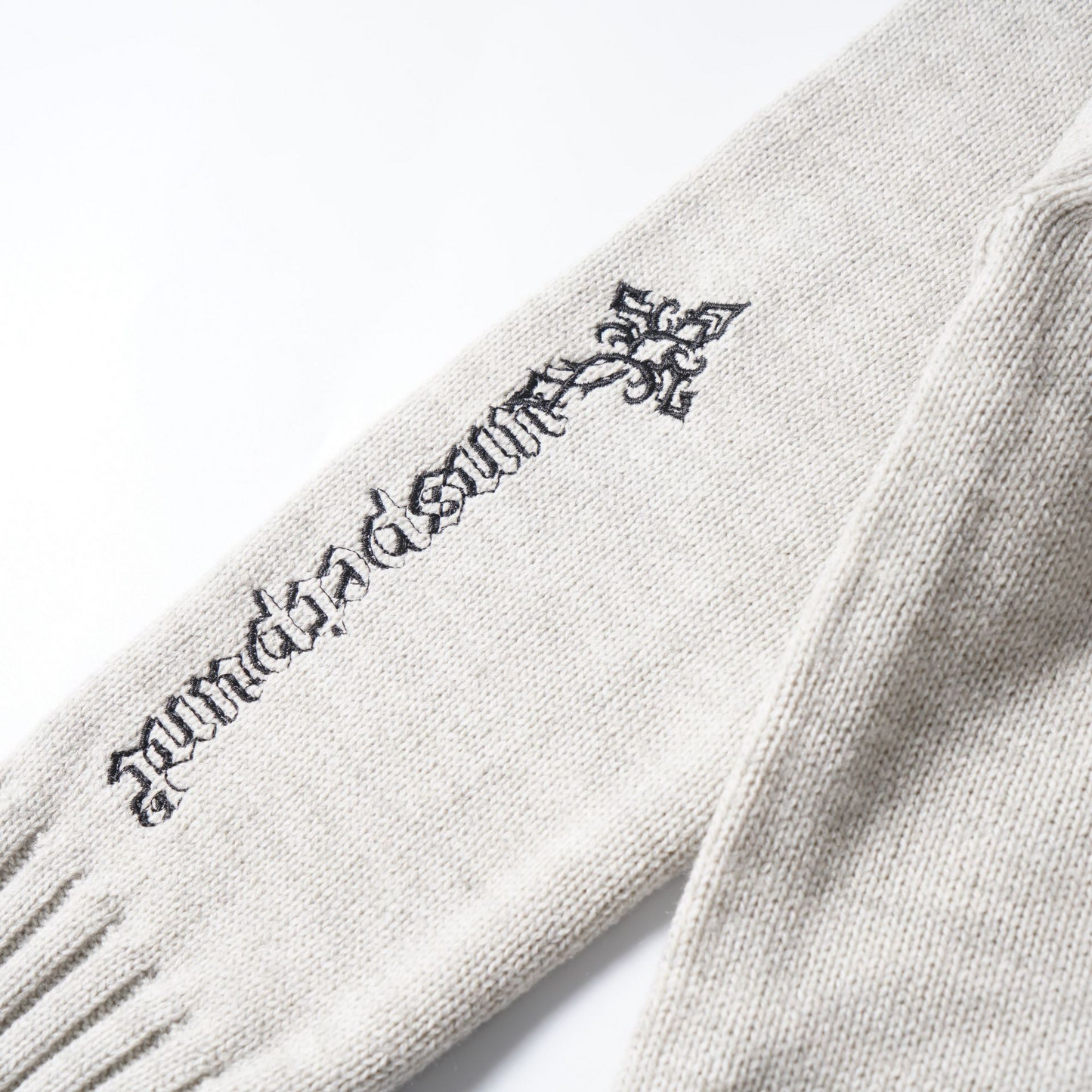 ロゴワンポイントハイネックジップアップニット/cm0124