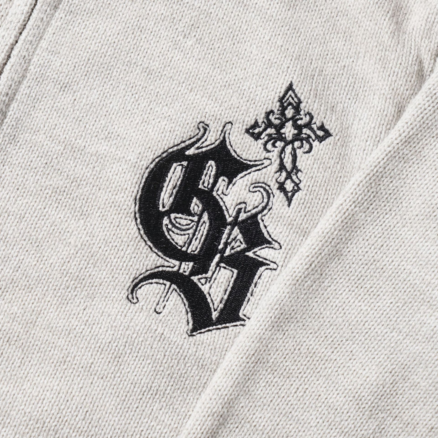 ロゴワンポイントハイネックジップアップニット/cm0124